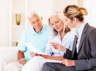 Couple discussing finances with advisor